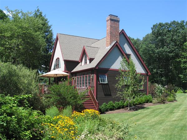 5 Granville Road Lincoln, MA 01773 - Photo 30 of 30 a view of a house with brick walls and a yard with plants