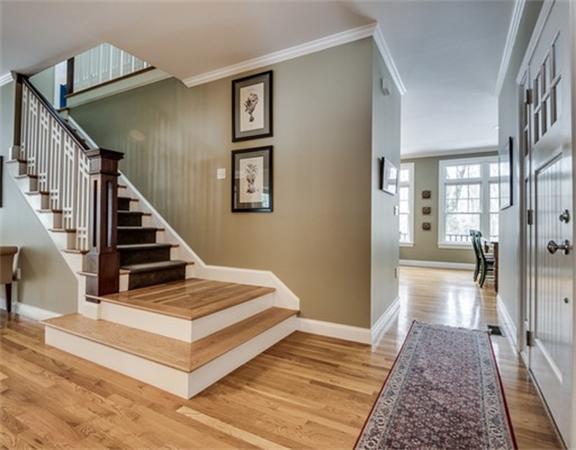 5 Granville Road Lincoln, MA 01773 - Photo 3 of 30 a view of a hallway with wooden floor and staircase