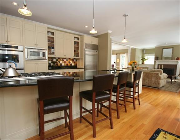 5 Granville Road Lincoln, MA 01773 - Photo 9 of 30 a kitchen with stainless steel appliances granite countertop table chairs stove a sink and dishwasher