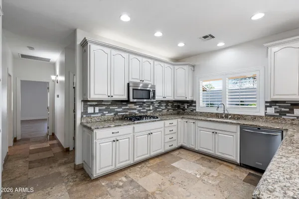 a bathroom with a shower a toilet and a mirror
