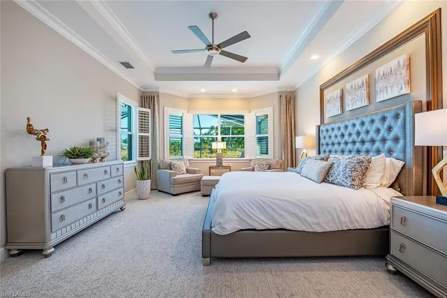 a spacious bedroom with a bed a bed and a large window with the outer view