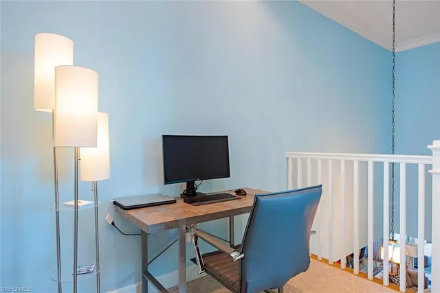 a view of a workspace with furniture