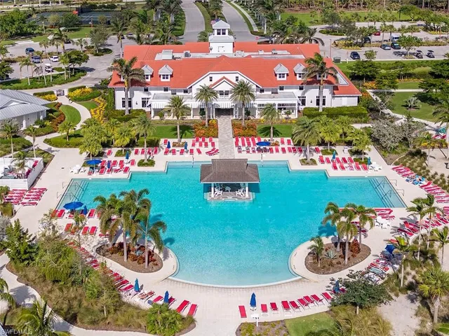 a view of swimming pool with outdoor seating and yard