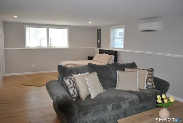 a living room with furniture and a window