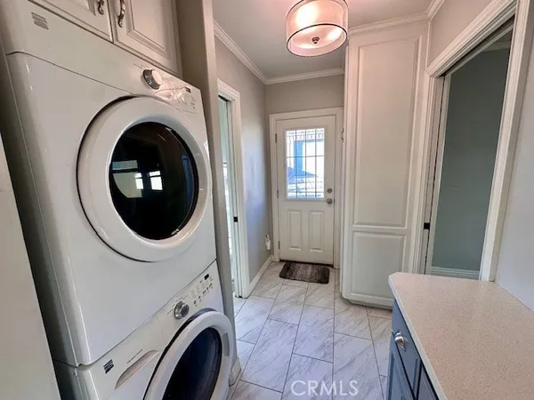 a view of a hallway with washer and dryer