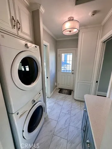 a view of a hallway with washer and dryer
