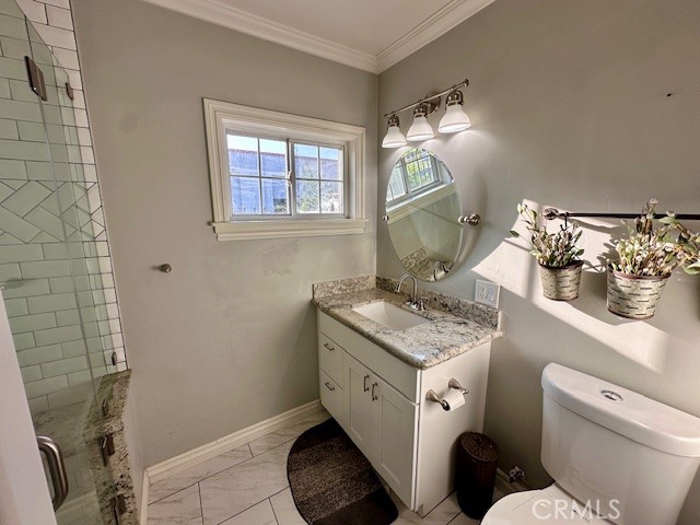 519 East Stuart Avenue Redlands, CA 92374 - Photo 16 of 36 a bathroom with a toilet sink and mirror