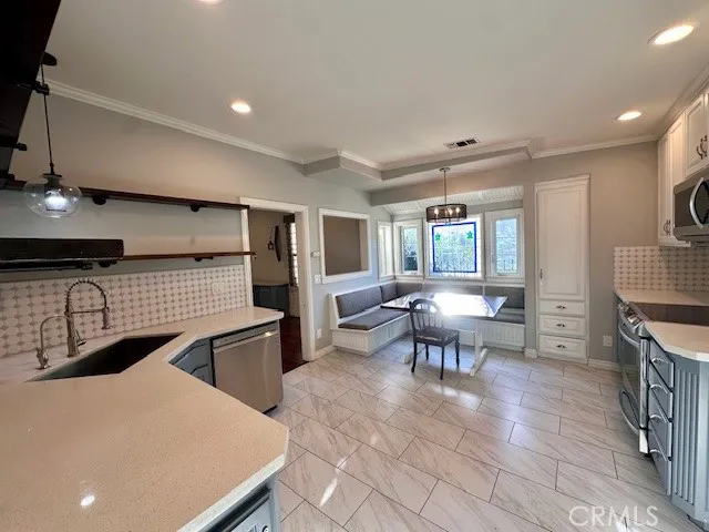 a lobby with furniture and a table