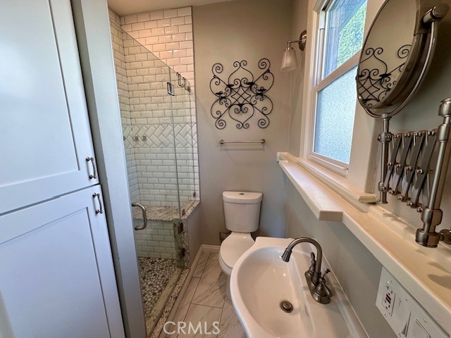 519 East Stuart Avenue Redlands, CA 92374 - Photo 34 of 36 a bathroom with a sink and a mirror