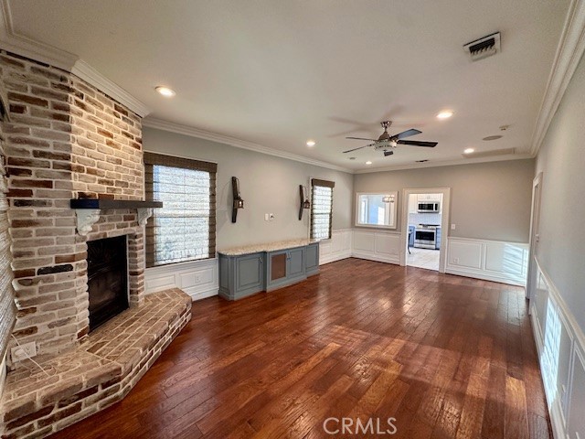 519 East Stuart Avenue Redlands, CA 92374 - Photo 9 of 36 a view of an empty room with a fireplace and a window