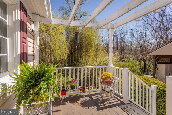 a view of a balcony with wooden floor