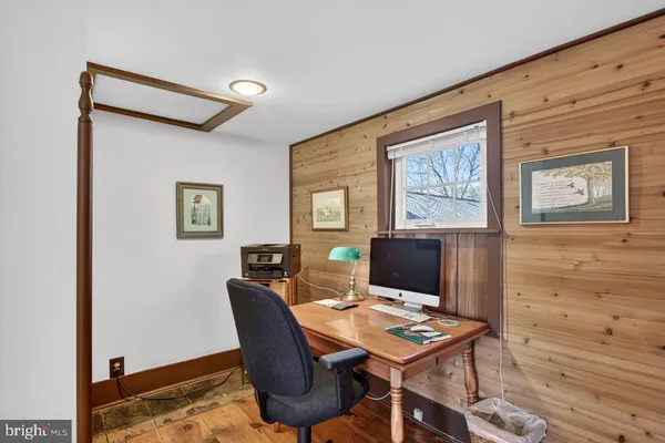 a workspace with furniture and window