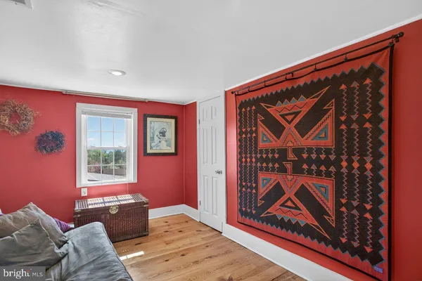 a bed room with a bed and a window