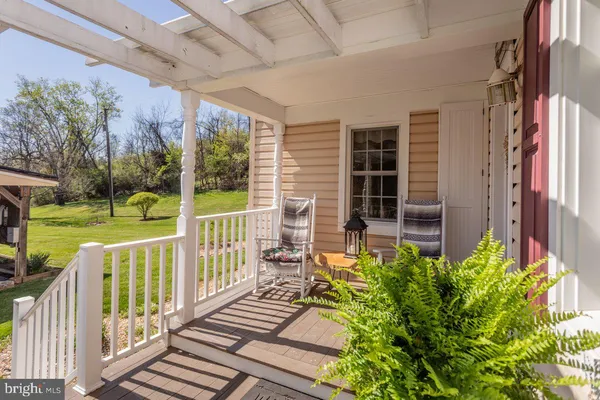 a view of a porch with a bench in balcony