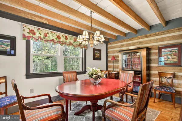 a view of a dining room with furniture window and outside view