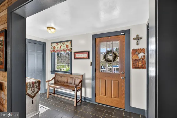 a bedroom with furniture and a window