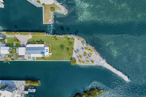 an aerial view of a house with a yard