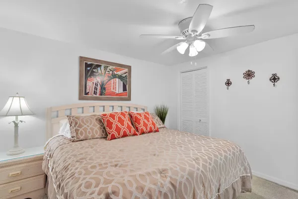 a spacious bedroom with a bed and walk in closet