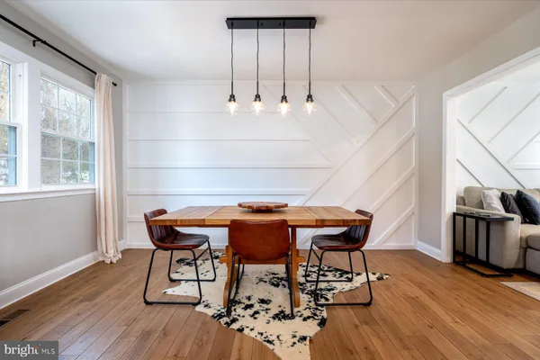 a view of a dining table and chairs in a room