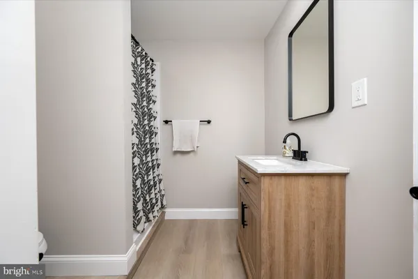 a bathroom with a sink and mirror
