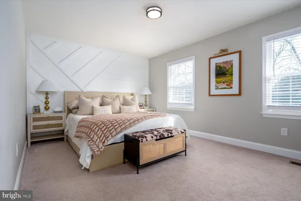 a bed room with a bed and a window