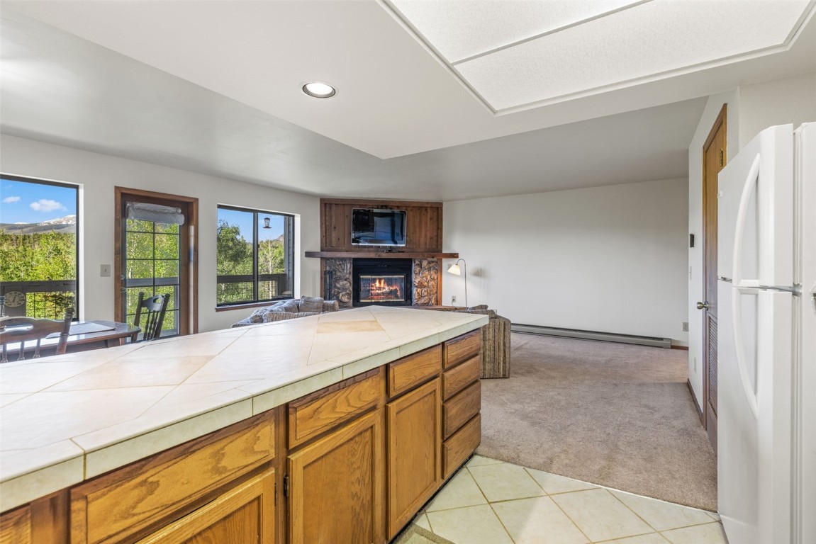 4624 Ryan Gulch Road, Unit 4624 Silverthorne, CO 80498 - Photo 13 of 31 a kitchen with a refrigerator and a sink