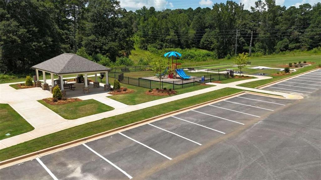 23 Rowlett Place Winder, GA 30680 - Photo 17 of 17 a view of a tennis ground with large trees