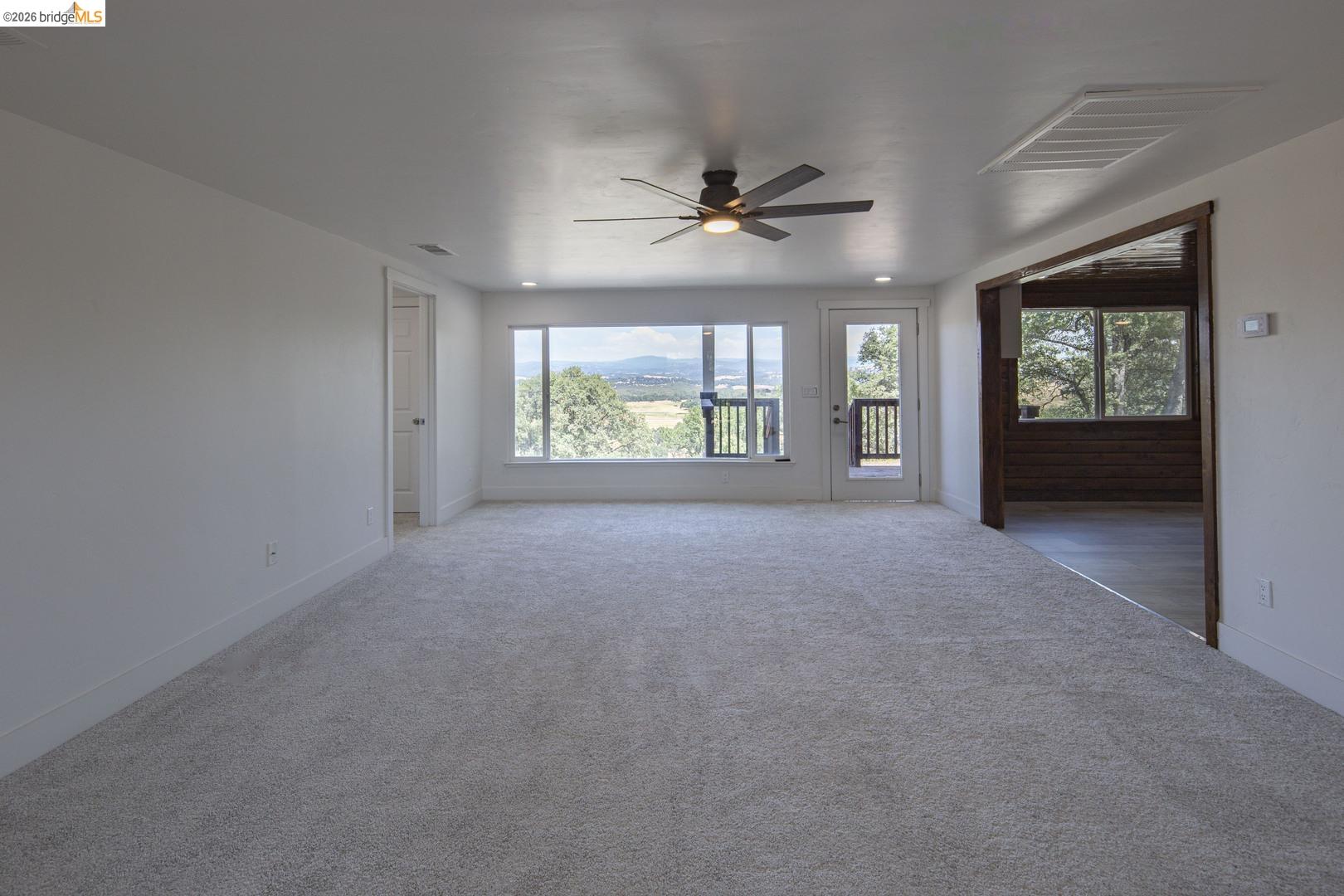 14594 Perricone Road Jamestown, CA 95327 - Photo 14 of 39 a view of livingroom with furniture ceiling fan and window