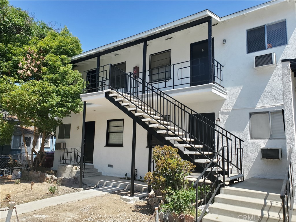 a front view of house with yard and seating area