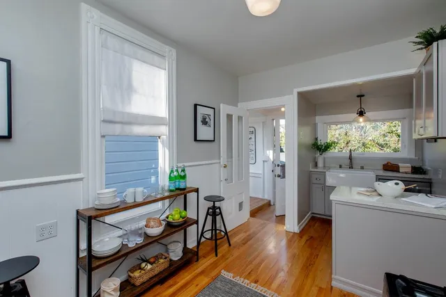 a living room with furniture and a rug