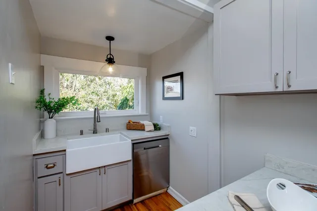 a bath tub sitting in a room next to a window