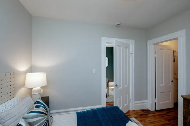 a white toilet sitting next to a bathroom sink