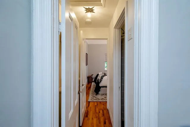 a view of a hallway view with a mirror