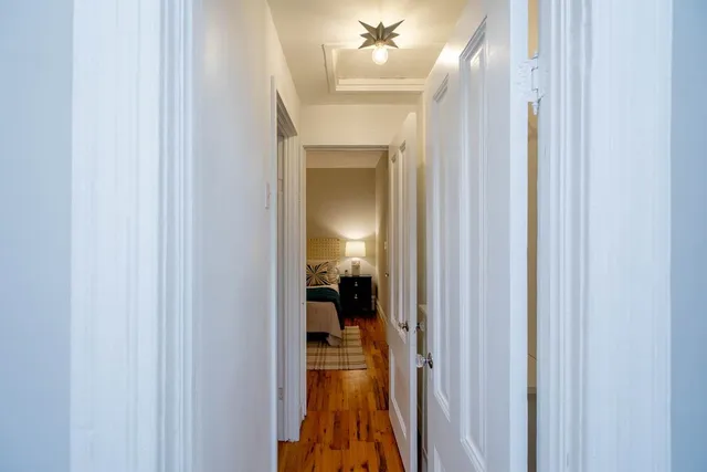 a bed room with a bed and a lamp