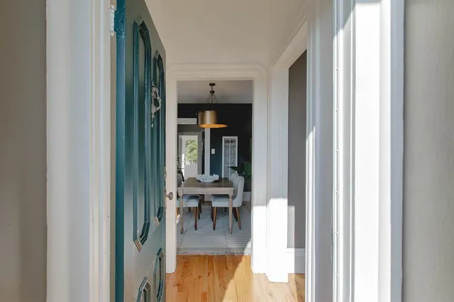 a view of living room with furniture and wooden floor