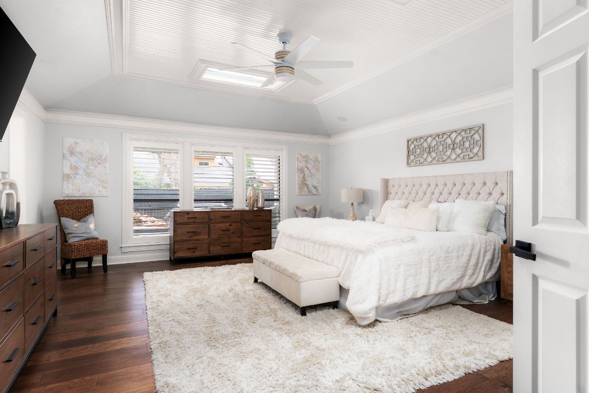 10218 Braemar Drive Austin, TX 78747 - Photo 15 of 34 Bedroom featuring ornamental molding, dark wood finished floors, lofted ceiling, and a ceiling fan