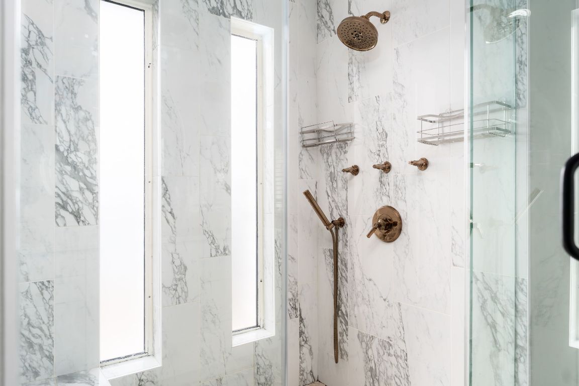 10218 Braemar Drive Austin, TX 78747 - Photo 21 of 34 Full bath with a marble finish shower