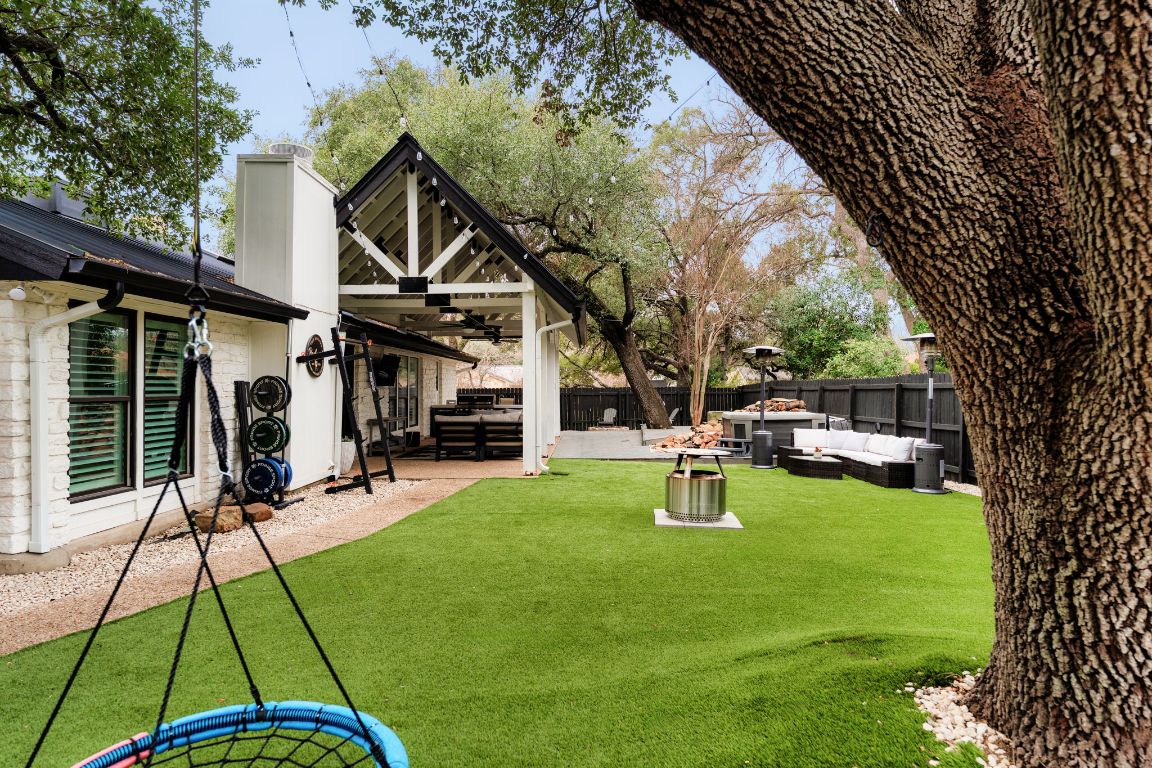 10218 Braemar Drive Austin, TX 78747 - Photo 33 of 34 Fenced backyard featuring outdoor lounge area, a ceiling fan, and a patio area