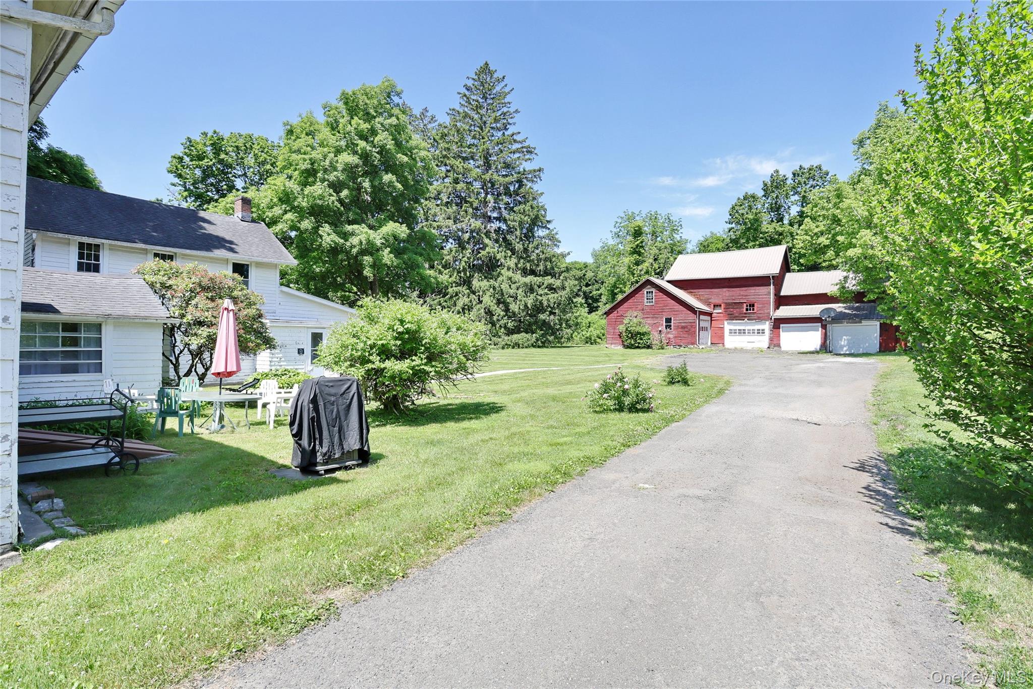 500 Haverstraw Road Suffern, NY 10901 - Photo 29 of 36 a front view of a house with a garden and yard