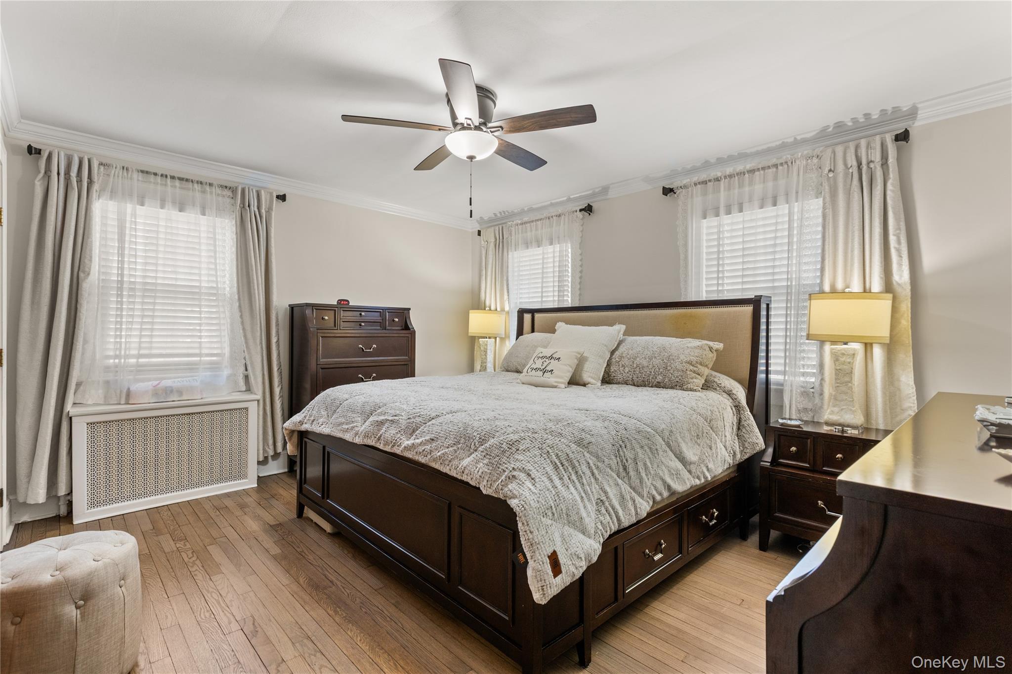 26 Community Road Bay Shore, NY 11706 - Photo 11 of 27 a bedroom with a bed and window