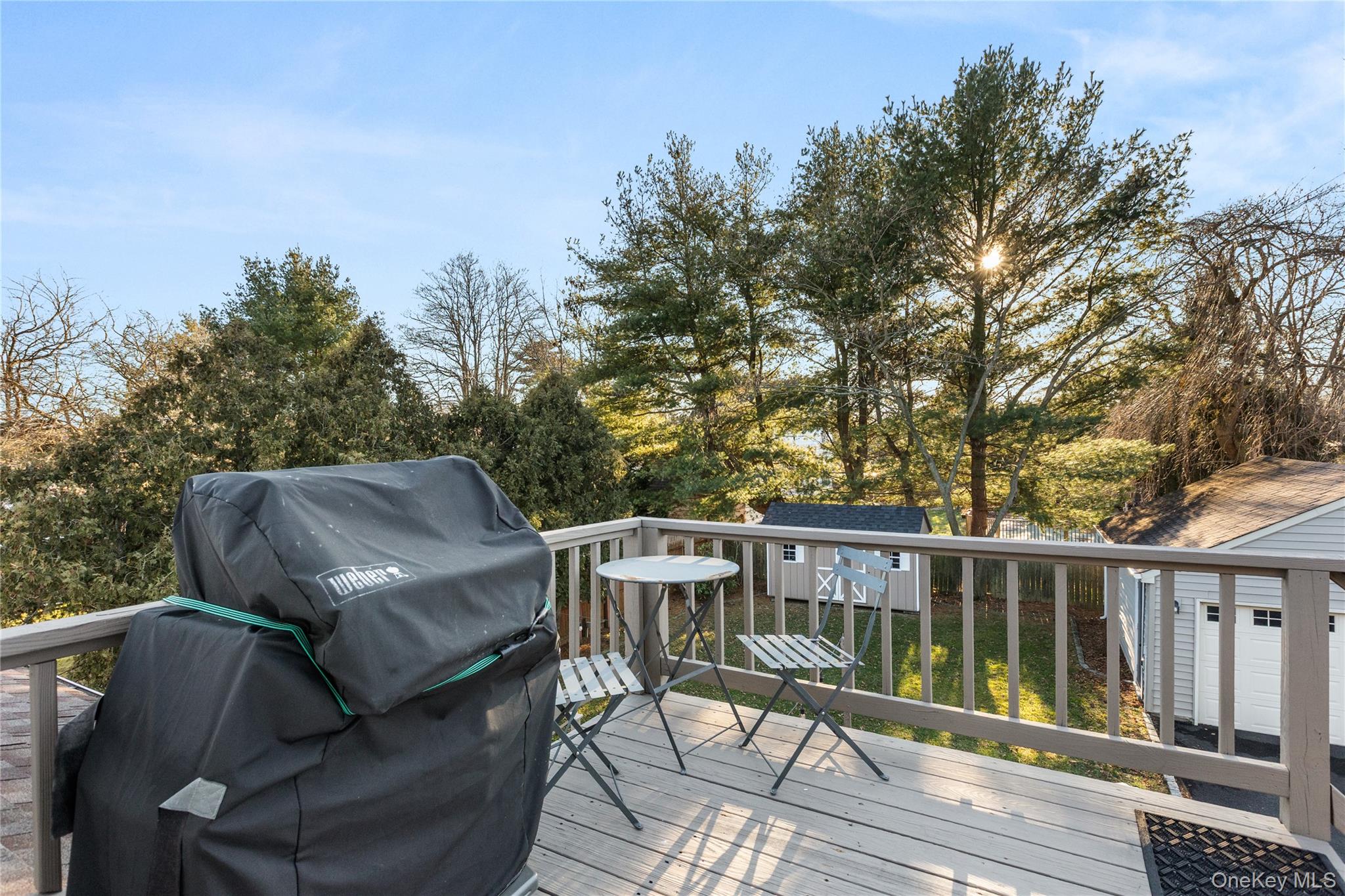 26 Community Road Bay Shore, NY 11706 - Photo 23 of 27 a view of balcony with furniture and trees