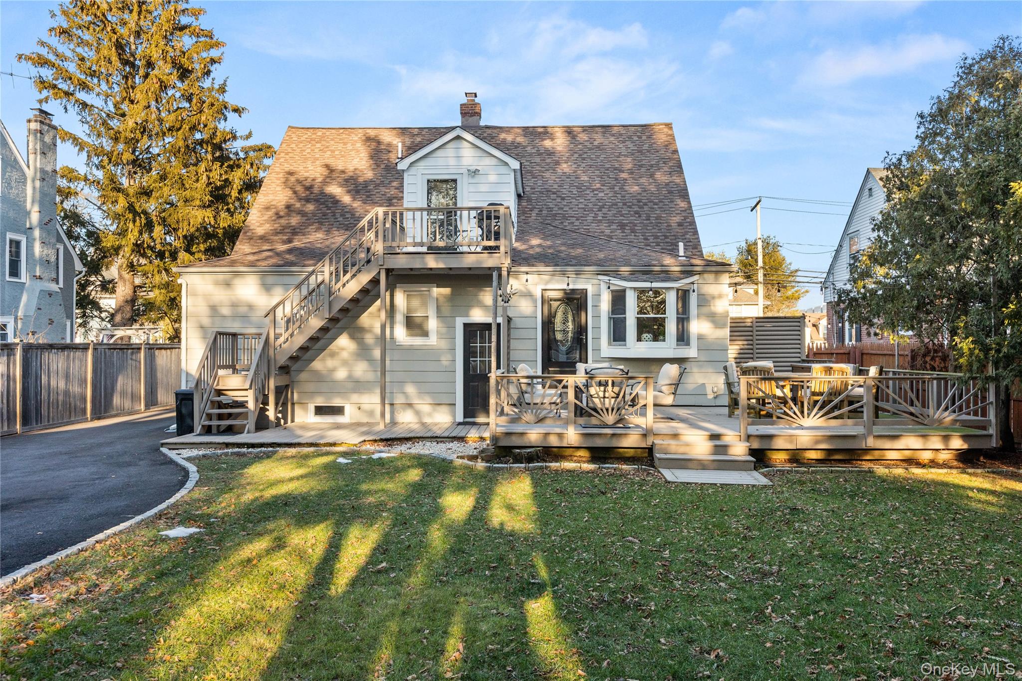 26 Community Road Bay Shore, NY 11706 - Photo 26 of 27 a front view of residential houses with yard and trees