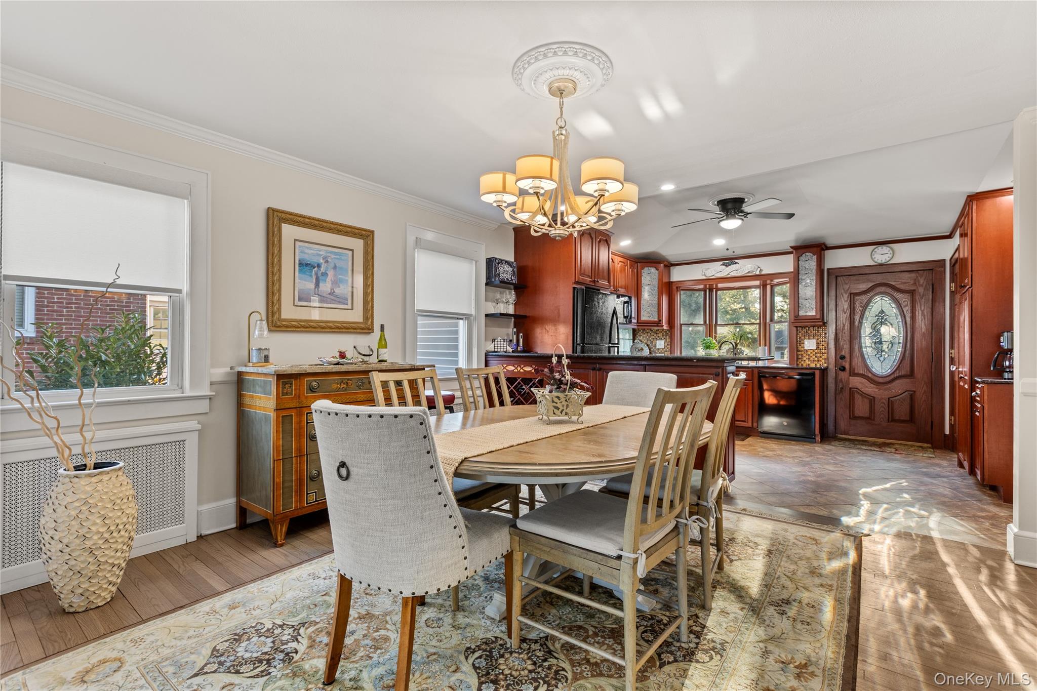 26 Community Road Bay Shore, NY 11706 - Photo 6 of 27 a view of a dining room with furniture a chandelier and wooden floor