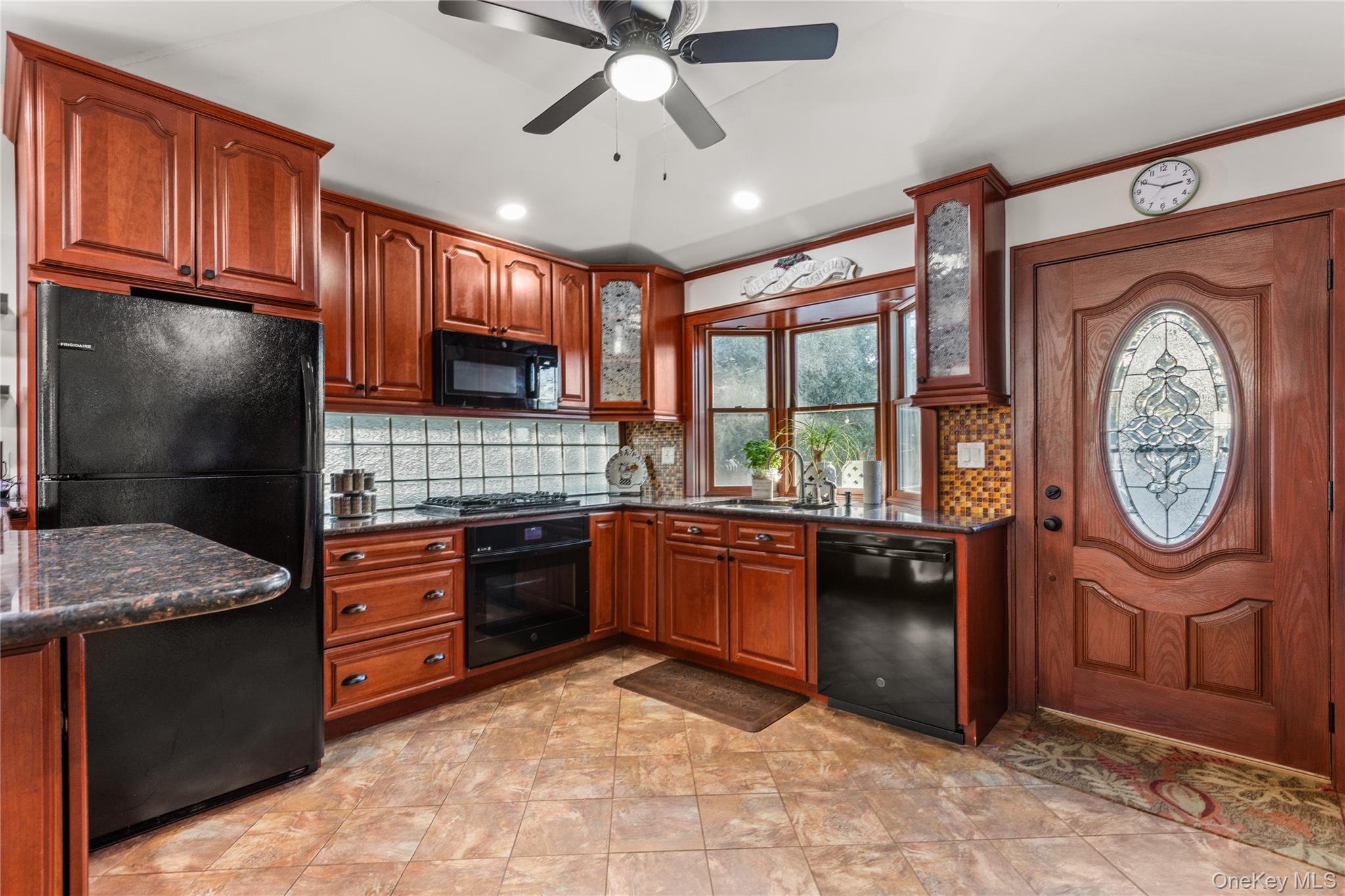 26 Community Road Bay Shore, NY 11706 - Photo 8 of 27 a kitchen with stainless steel appliances granite countertop a stove sink and cabinets