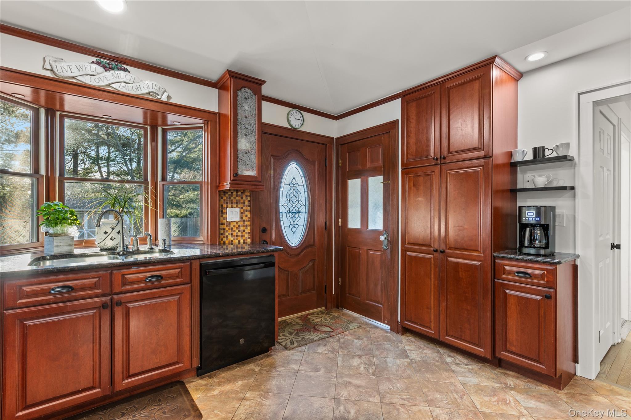 26 Community Road Bay Shore, NY 11706 - Photo 10 of 27 a kitchen with stainless steel appliances granite countertop a refrigerator and a sink