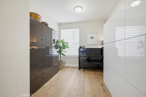a kitchen with a refrigerator and a stove