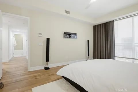 a spacious bathroom with a tub sink shower and mirror