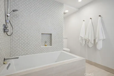 a bathroom with a sink a toilet and a bathtub