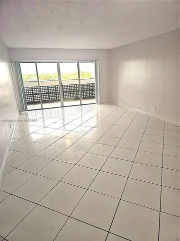 a view of an empty room and a windows