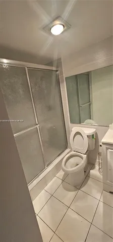 an empty room with wooden floor